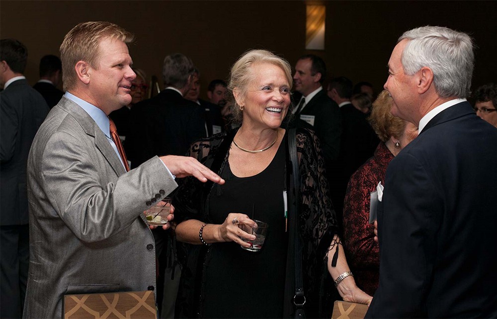 Gold Sponsor GHX’s Scott Kelley (left) and Karen Conway (center) share a lighter moment with Bellwether Class of 2014 Honoree Joe Pleasant (right).