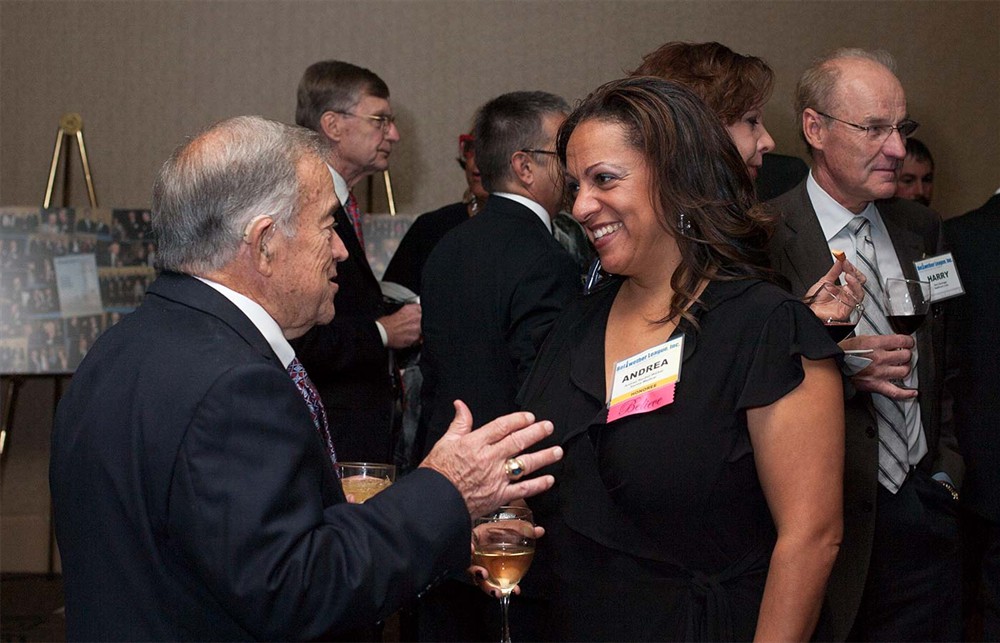 Bellwether Class of 2014 Honoree Norm Krumrey (left) chats with Andrea Reubel-Walker, daughter of Bellwether Class of 2014 Honoree Earl Reubel.