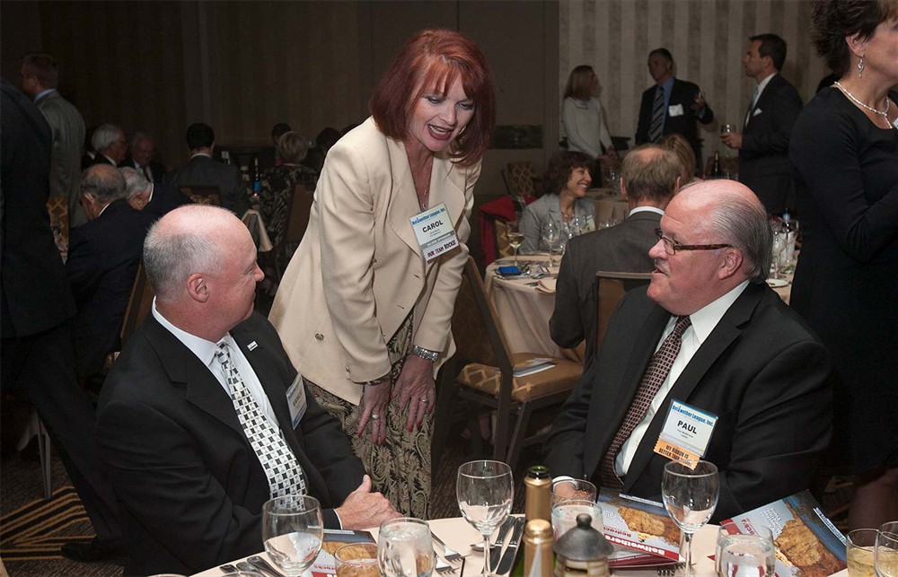 Silver Sponsor C.R. Bard’s Carol Stone (center) converses with Bellwether League Inc. Board Member Vance Moore (left) and LeeSar’s Paul McWhinnie (right).