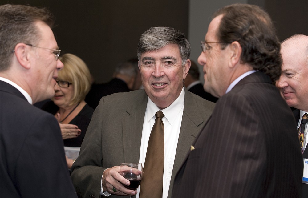 Health Care Solutions Bureau’s Michael Bohon (center) listens in as Bellwether League Inc. Co-Founder and Executive Director Rick Barlow (left) speaks with Jim Hersma (Bellwether Class of 2012)