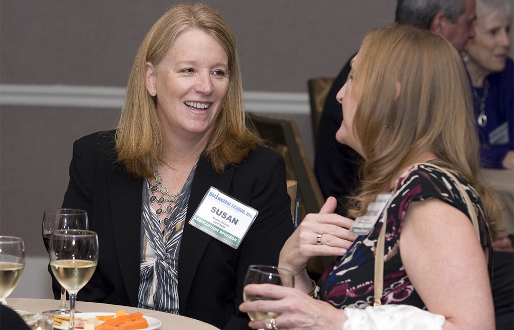IAHCSMM Executive Director-designate Susan Adams (left) enjoys a conversation with Healthcare Purchasing News Publisher Kristine Russell (right)