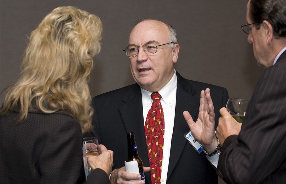 Bellwether League Inc. Board Member Mike Louviere chats with Jim Hersma (Bellwether Class of 2012) (right) and his wife Carol Hersma (left, back to camera)