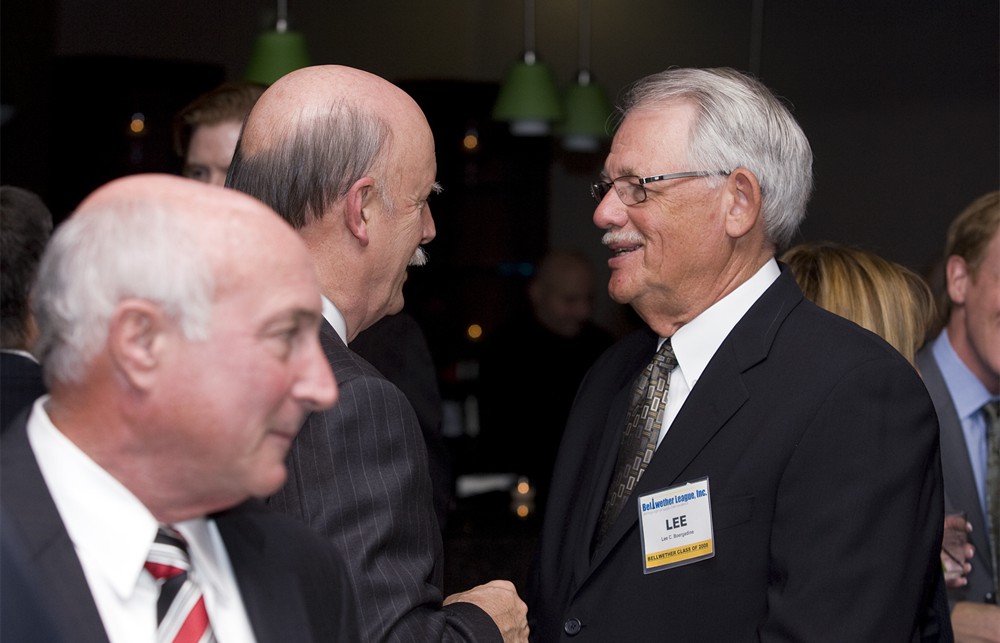: Lee Boergadine (Bellwether Class of 2008) greets Bellwether League Inc. Founding Board Member Dick Perrin (center) with Carl Manley (Bellwether Class of 2012) in the foreground on the left)