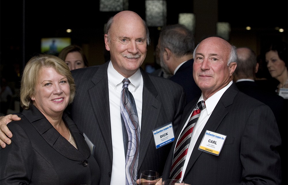 Bellwether League’s Dick Perrin congratulates Carl Manley (Bellwether Class of 2012) and his wife Susan Manley