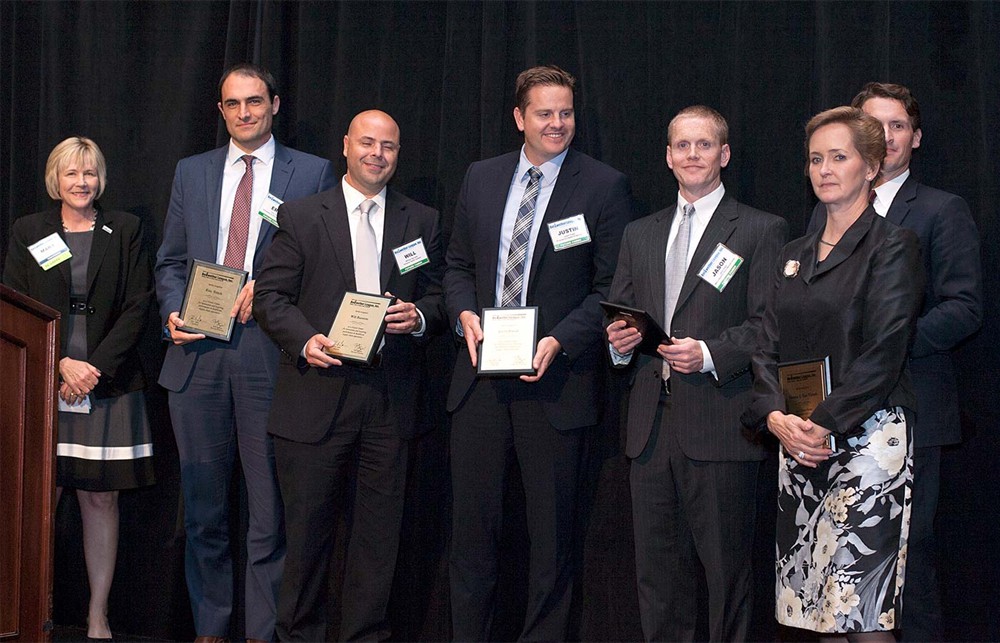 Bellwether League Inc. Treasurer Mary Starr salutes the Future Famers Class of 2015 (from left to right): University of Chicago’s Eric Tritch, Ochsner Health’s Will Barrette, Providence Health’s Justin Freed, Mercy Health/St. Rita’s Jason Hays, Parkview Health’s Donna Van Vlerah and Texas Health’s Nate Mickish (back and to the right).