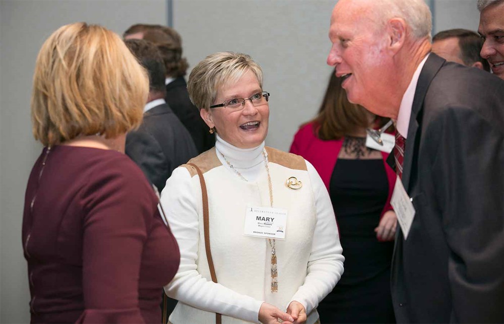 Mayo Clinic’s Mary Larson (center) with SMI’s Tom Hughes (Bellwether Class of 2012) (right) and Wendy Francis (left), wife of Bellwether Class of 2017 Honoree Jim Francis.