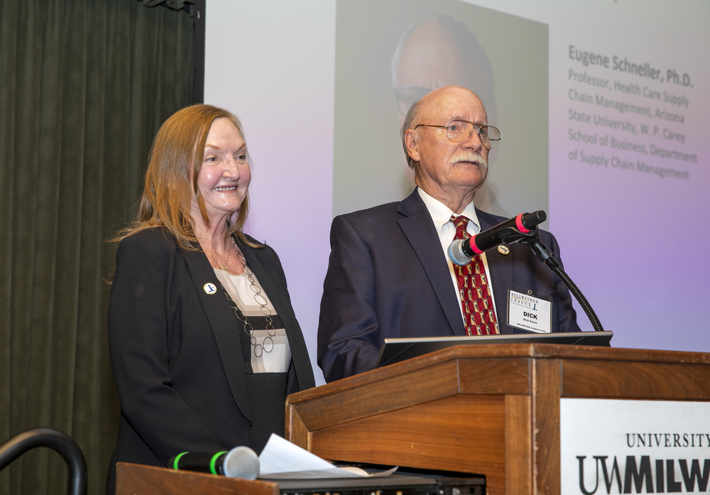 Kristine Russell and Dick Perrin tag-team to introduce the fourth Bellwether Honoree for induction