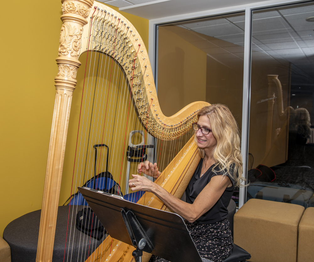 Harpist Laura Utley provides classical musical ambience.