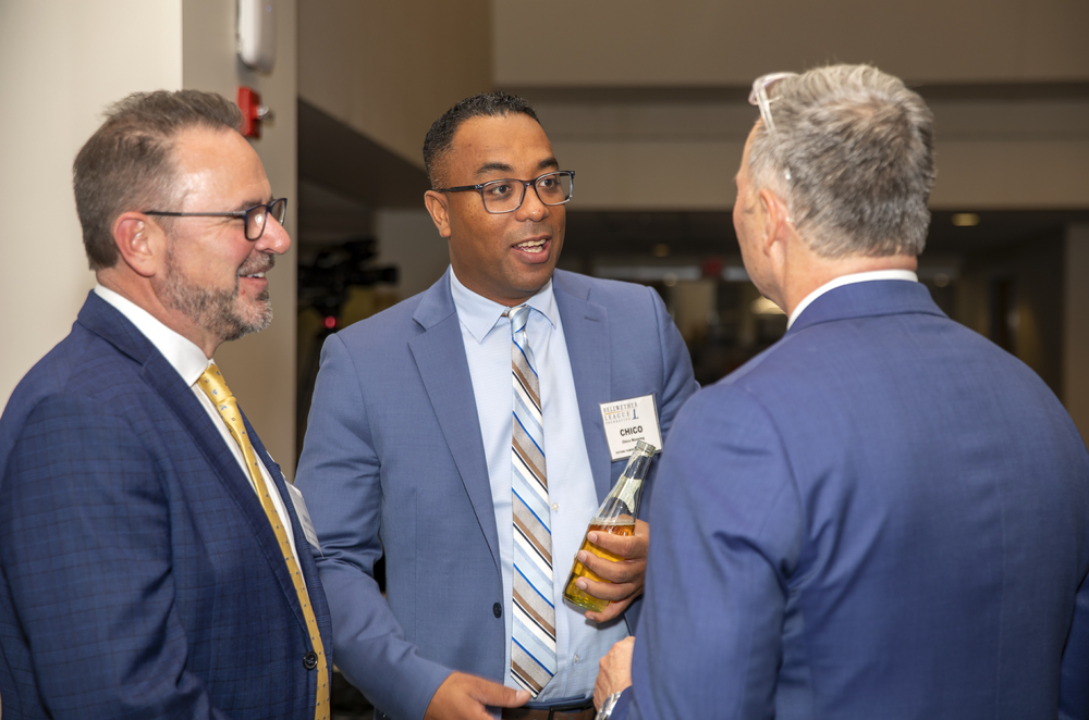 Chico Manning (center), Future Famers Class of 2024, and Bryan Hardman (left), ASP Global, BLF Silver Sustaining Sponsor, converses.