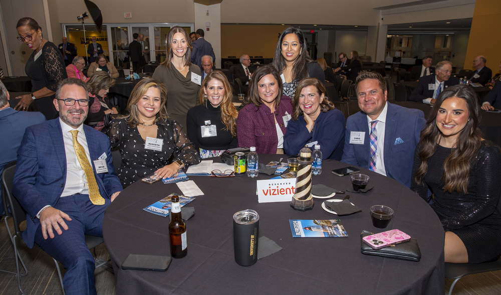 Having a greater time at Vizient table 2: Seated (left to right): Bryan Hardman, ASP Global, BLF Silver Sustaining Sponsor; Bergeth Guzman, Vizient; Jess Hurd, Future Famers Class of 2019, Vizient; Karen Kresnik, Future Famers Class of 2017, Vizient; Jamie Meyer, Vizient; Chris Lockhart, Vizient; and Danielle McCarthy, Vizient. Standing (left to right): Lara Latham, Vizient; and Amanda Chawla, MHA, FACHE, CMRP, Ammer Honoree Class of 2024, Vice President and Chief Supply Chain Officer, Stanford Medicine, Palo Alto, CA.