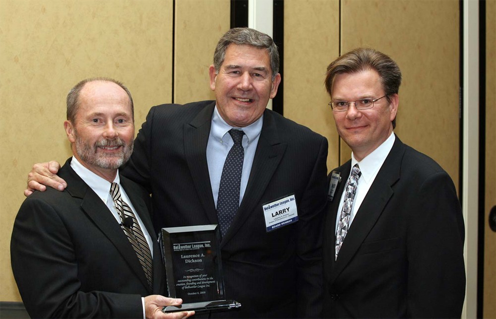 Retiring BLI Founding Board Member Laurence A. Dickson (center) is flanked by BLI Co-Founder and Chairman Jamie C. Kowalski and BLI Co-Founder and Executive Director Rick Dana Barlow