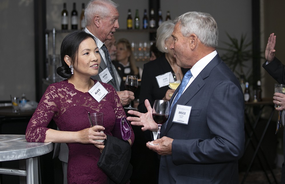Alice Chan (left) talks with Bruce Smith, both from Silver Sustaining Sponsor Omnicell.