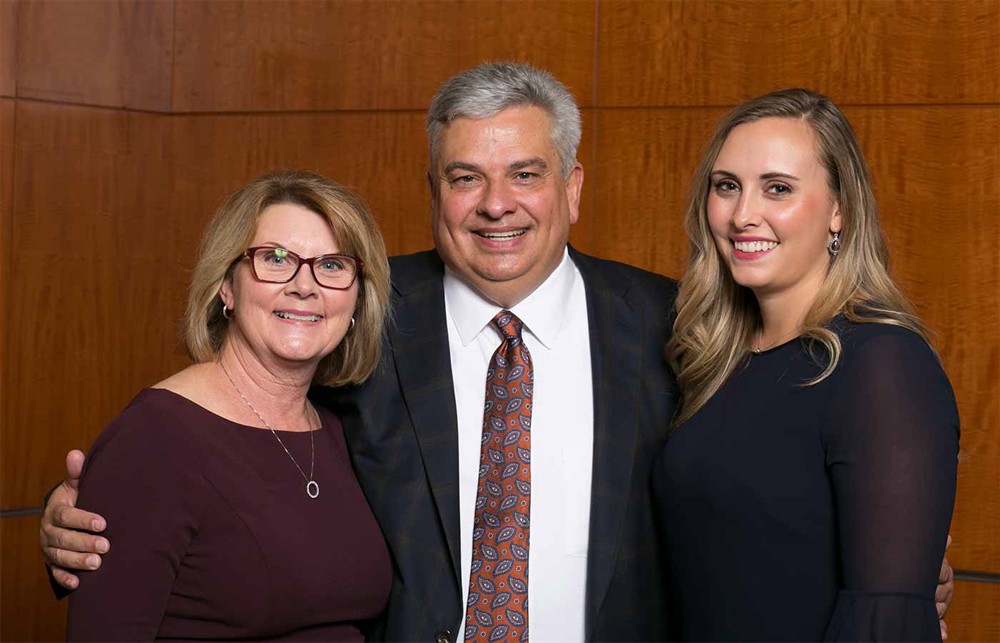 The Francis Family: Bellwether Class of 2017 Inductee James Francis (center) with wife Wendy Francis (left) and daughter Samantha Francis (right).