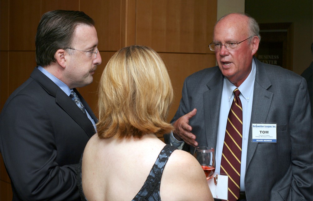 Board Member Thomas W. Hughes (right) talks with Appleseed Healthcare Resources' Joe Colonna and wife Ann Colonna